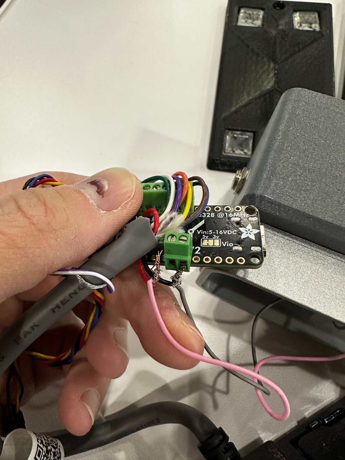 A door simulator taken apart, showing the controller board and wiring