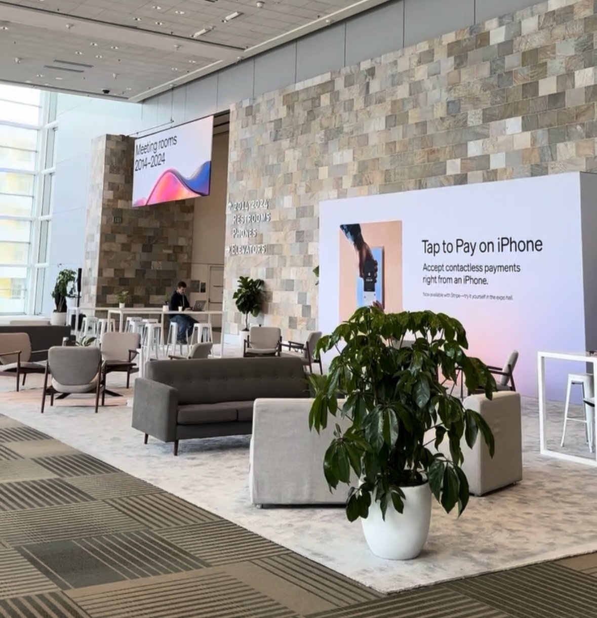 Tap to Pay on iPhone display in the Stripe Sessions lobby